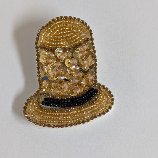 Spilla per capi unisex, Chapeau