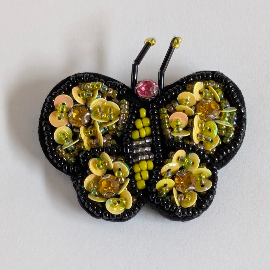 Spilla per giacca donna, Fly