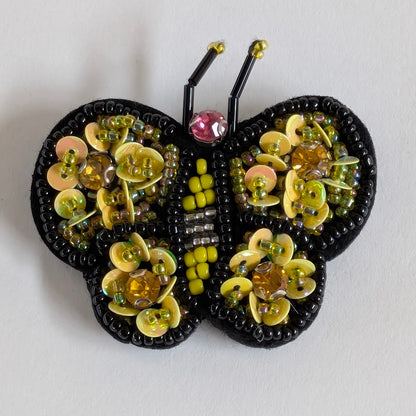 Spilla per giacca donna, Fly